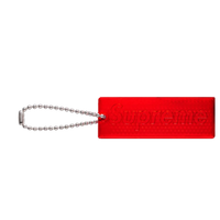 Courtside Gear red Supreme reflective rectangular keychain with a silver ball chain attachment